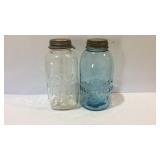 Two half gallon mason jars one Ball and one Atlas