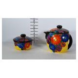 Painted ceramic teapot and dish with lid, made in