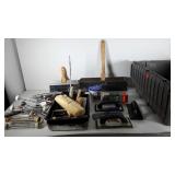 Tote full of painting, tiling and drywall tools
