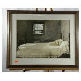 Framed print of dog sleeping on bed. 34"×27".