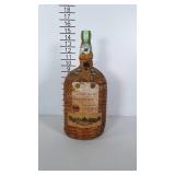 Wicker wrapped Bacardi green glass gallon jug.