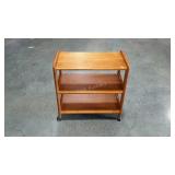 Multi-use, three tiered cart on wheels.