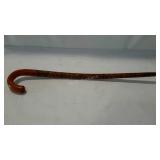 Tourist walking cane, carved and oainted.