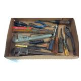 Screw drivers, pliers, adjustable wrenches in