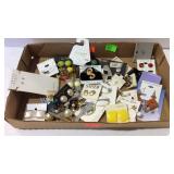 Flat of costume jewelry mostly earrings