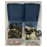 Two containers of costume jewelry