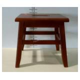 Small step stool with cut out handle.