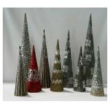 Nine decorative cones with embellishments.