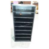Magazine or paper storage rack. Painted black.