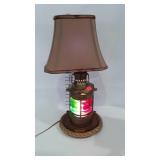 Brass nautical lamp with shade, base lights up,