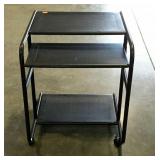 Tubular steel computer station/cart on wheels.