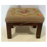 Needlepoint footstool.