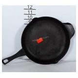 9 inch cast iron pan in usable condition. Marked