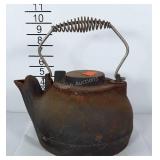 Heavy cast iron tea pot has rust and needs
