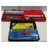 Three partial socket sets on cases.