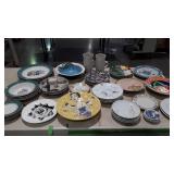 Large assortment of plates, bowls, cups. Lizard