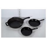 3 unmarked cast iron pans.