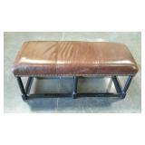 Padded leather foyer bench with brass tack