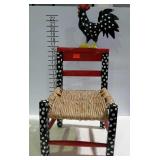 Child size chair with rooster theme.