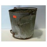 Milk bucket with pouring handle. Dented and