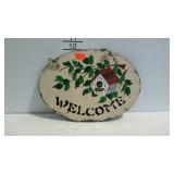 Painted slate welcome sign.