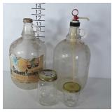 Two  1 Gal. Glass Jugs, & 2 Mason Jars w/ Lids