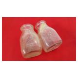 Pint size milk bottles, both from Thatxher