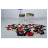 2 small canning jars with buttons.
