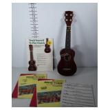 Unmarked Ukulele with tutorial book on how to