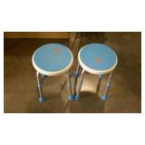 Two adjustable height shower stools.