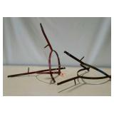 Two cow yoke fence guards.