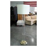 Clear tube floor lamp with shade. 65" high.