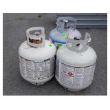 Three Propane tanks, one feels full, others have