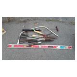 Tool lot, level, hedge Clippers, bow saw, tire