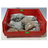 Parts bin with bags of wooden dowels and drawer