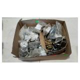 Flat of assorted hardware. Bolts, brackets,