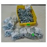Parts bin filled with bags of 1.5" carriage bolts