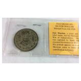 Old Mexican silver dollar