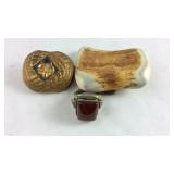 Money clip, belt buckle, and a plated ring