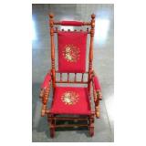 Embroidered spring rocker. On wheels. Has a