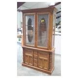 Two piece lighted china cabinet with etched glass