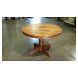 Round oak pedestal table, needs refinishing. 44"