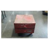 Metal two drawer shop cabinet with chippy red