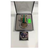 Military medal and a commemorative coin