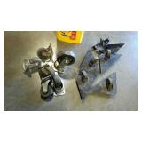 Bucket with assorted caster wheels. Some on iron