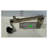 Commercial can opener with mounting bracket.