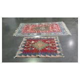 Two southwest design woven rugs. Larger one needs