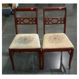 Two dining chairs with needlework seats. Need