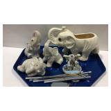Elephant decor with figurines, planter, and a