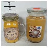 2 delicious smelling unused candles. One is Apple